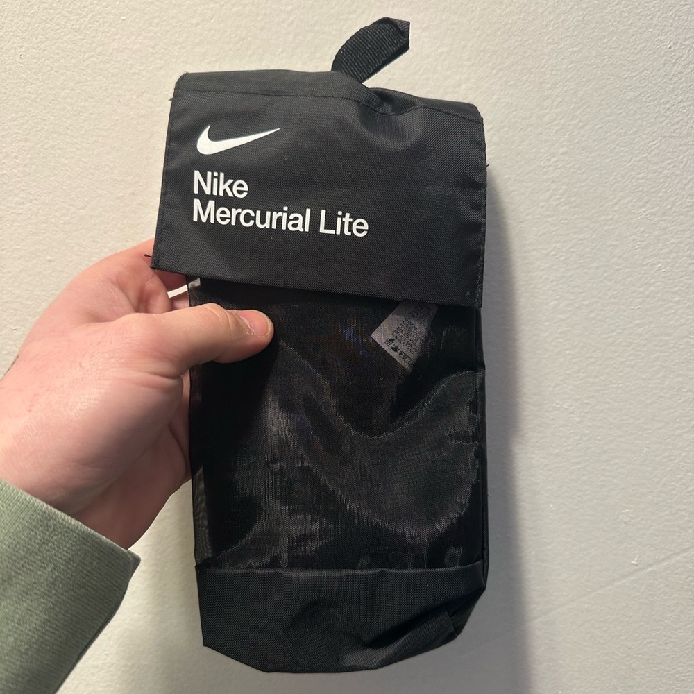 Nike Mercurial Lite Black shin guards in Bag